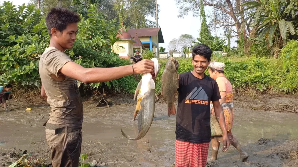 Huge throngs at the community fishing at Tarong River in Kokrajhar